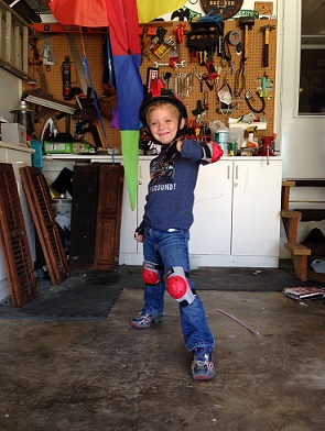 Melissa from MD: My little daredevil modeling his new bike gear.  Gotta protect the noggin' in the coolest way!